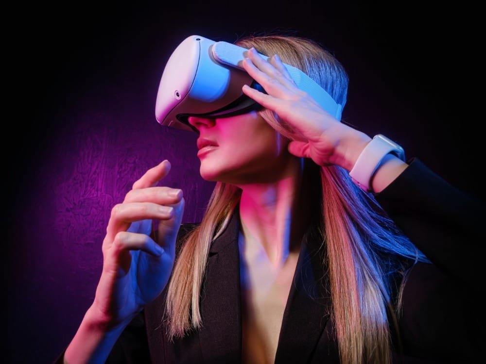 young woman with blond hair vr helmet looks around with surprise delight